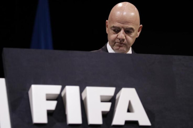 FIFA President Gianni Infantino walks on the stage before the start of the 69th FIFA Congress in Paris, Wednesday, June 5, 2019